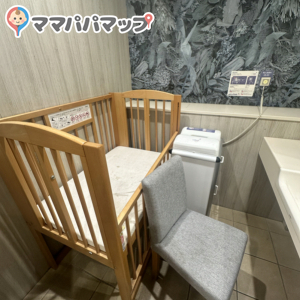 Has a crib as a Changing table. It was also dirty. Bring your own changing pad to lay your baby. Also has an outlet. 
